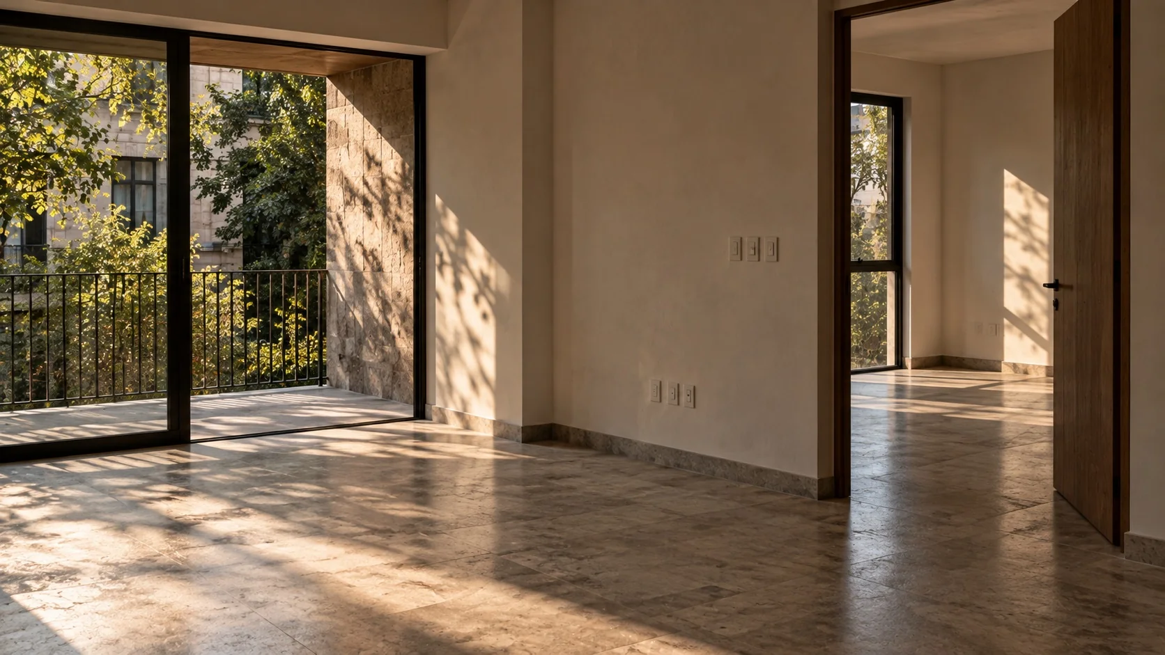 Empty contemporary Mexican apartment with open rooms and late-afternoon light